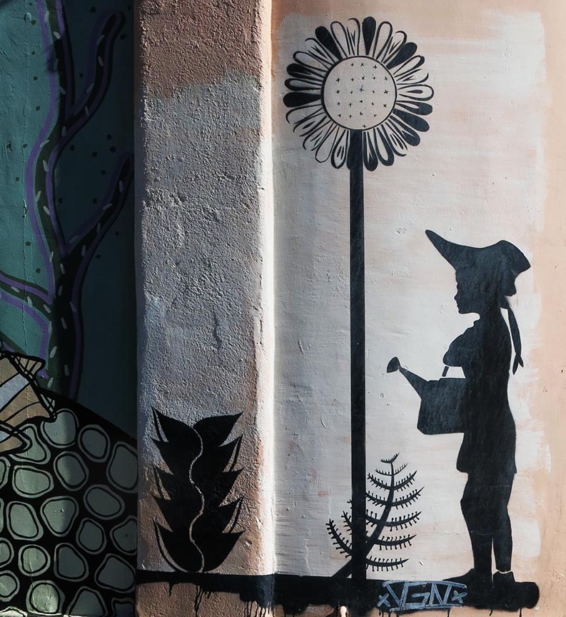 mural of girl watering a flower