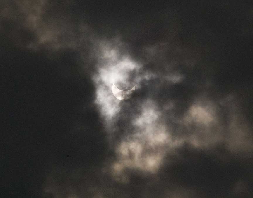 partial phase through clouds before totality